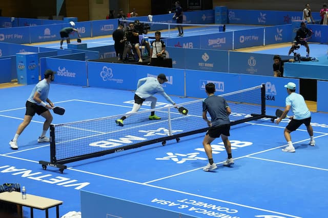 Two pickleball players, a man and a woman